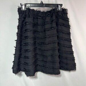 Woman’s black fringe skirt with pockets. Size 10.